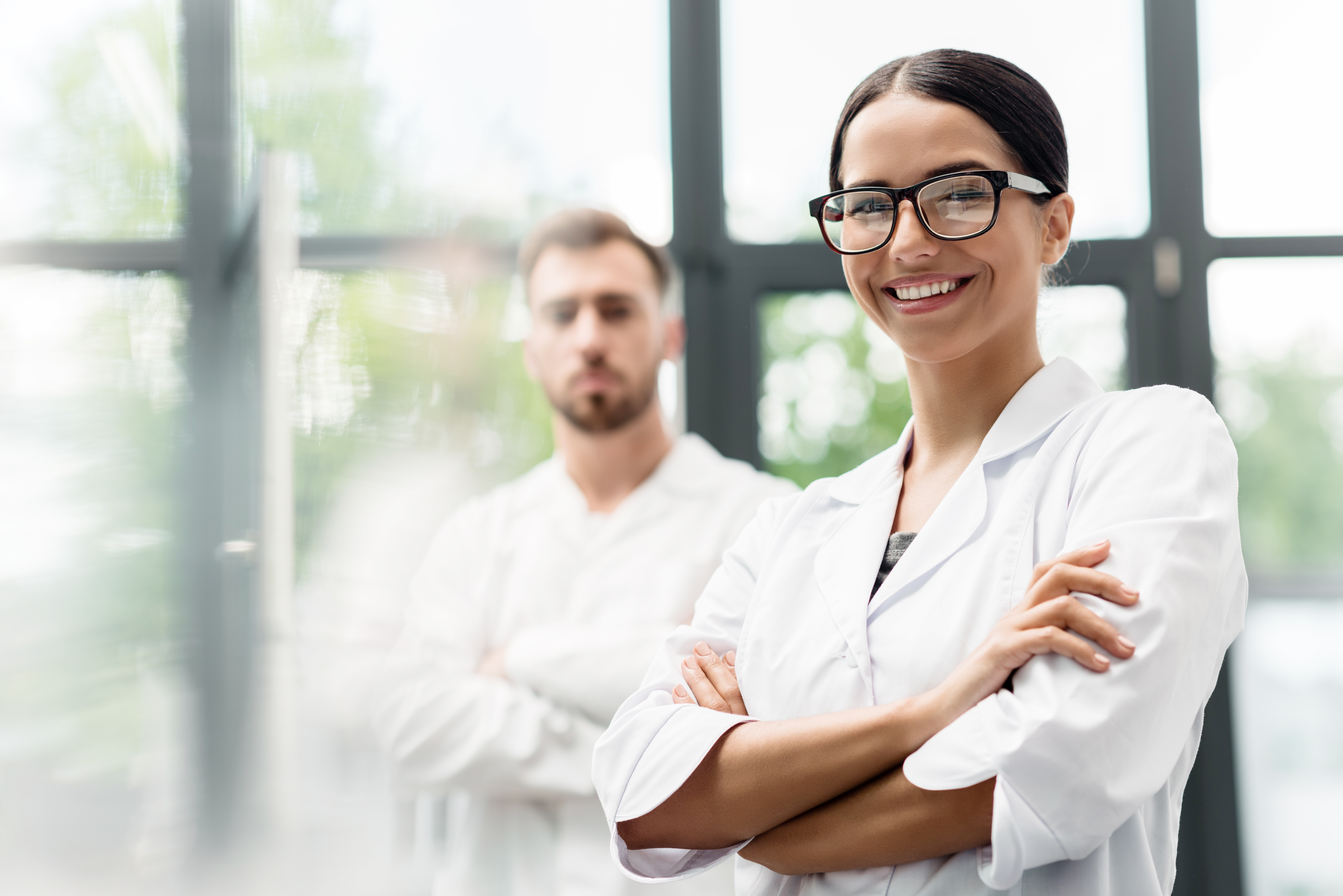 Researchers in a campus lab smiling