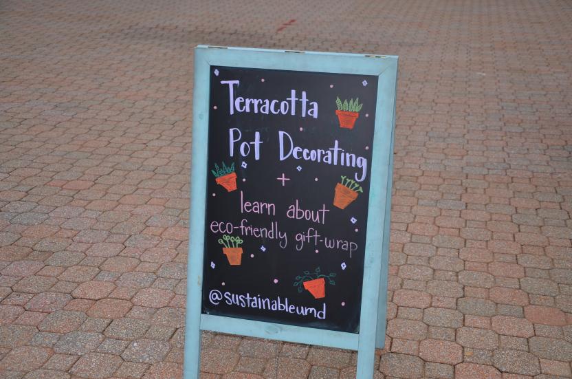 Terracotta Pot Decorating signage at the holiday market 
