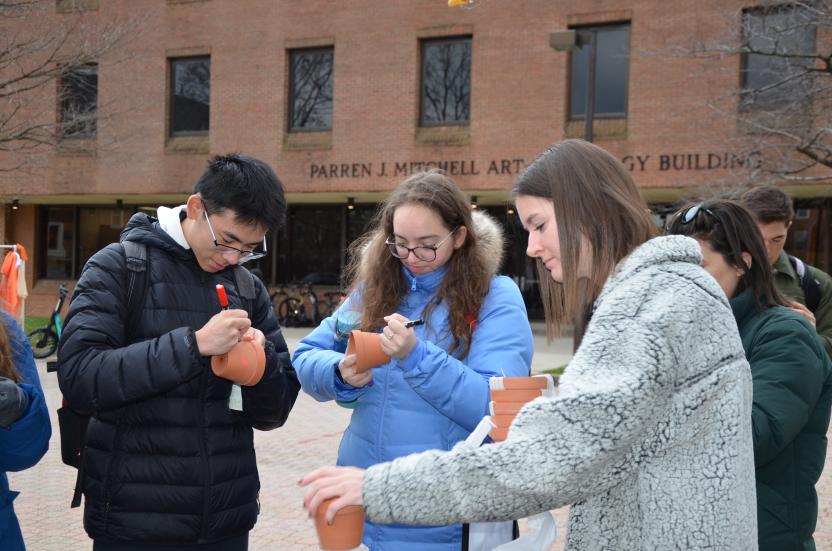 students decorating their pots