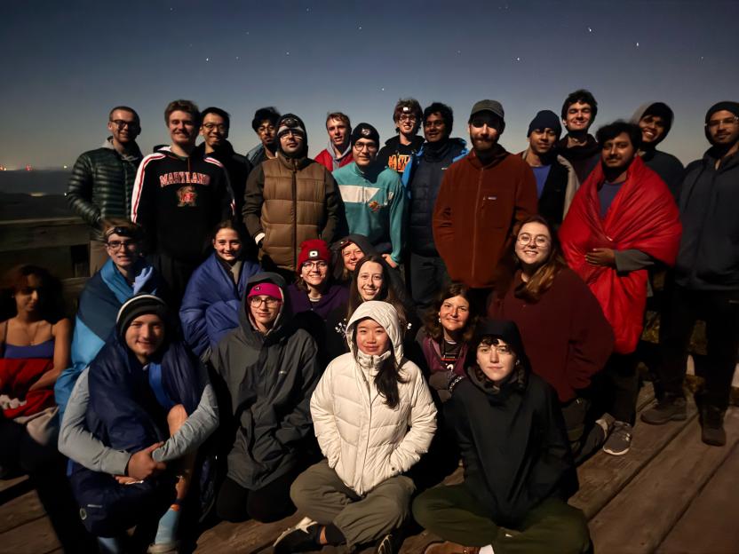 Students are photographed together outdoors after a hike.