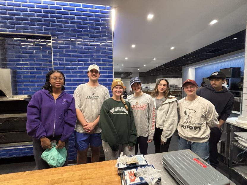 Students posing in the Y after completing a service event with Food Recovery Network.