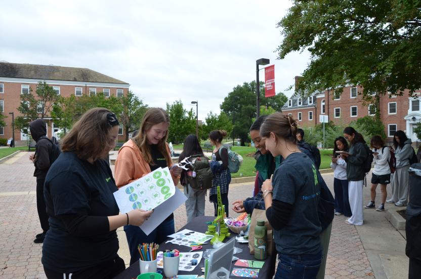 SustainableUMD ambassadors setting up materials for button making