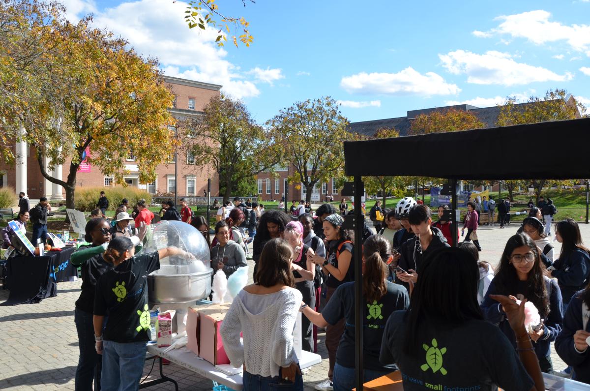 Students group together to win cotton candy at the 2025 Campus Sustainability Month Celebration.