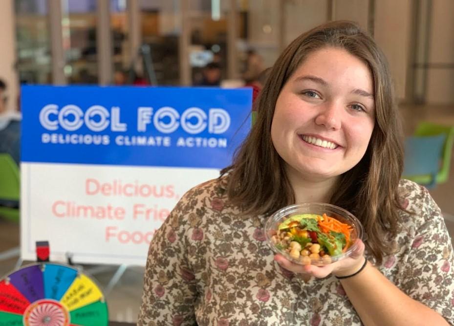 UMD Graduate Student and Office of Sustainability Outreach Associate poses at Cool Food Pledge Outreach event