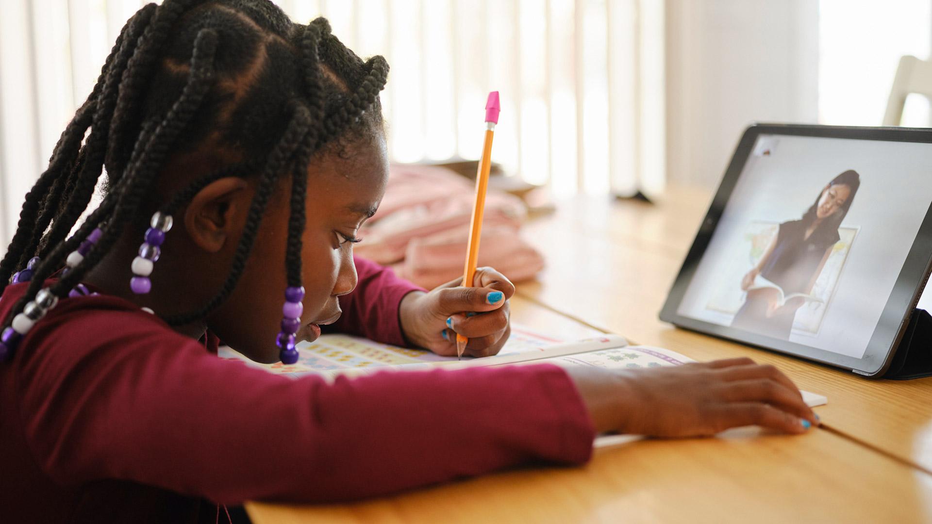 Young student studying using a tablet device. Photo credit: Rich Legg