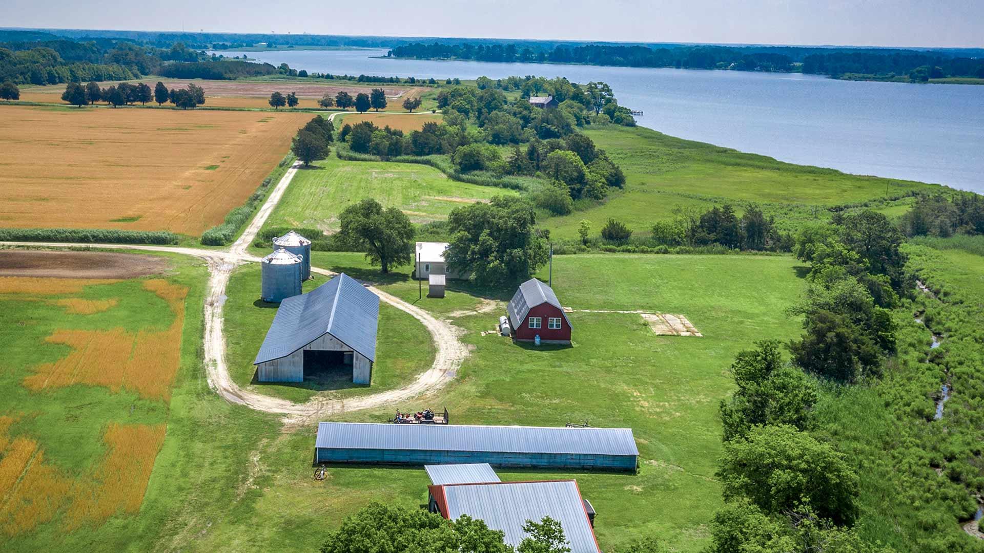 Arial view of Eastern Shore farm buildings and land along a river