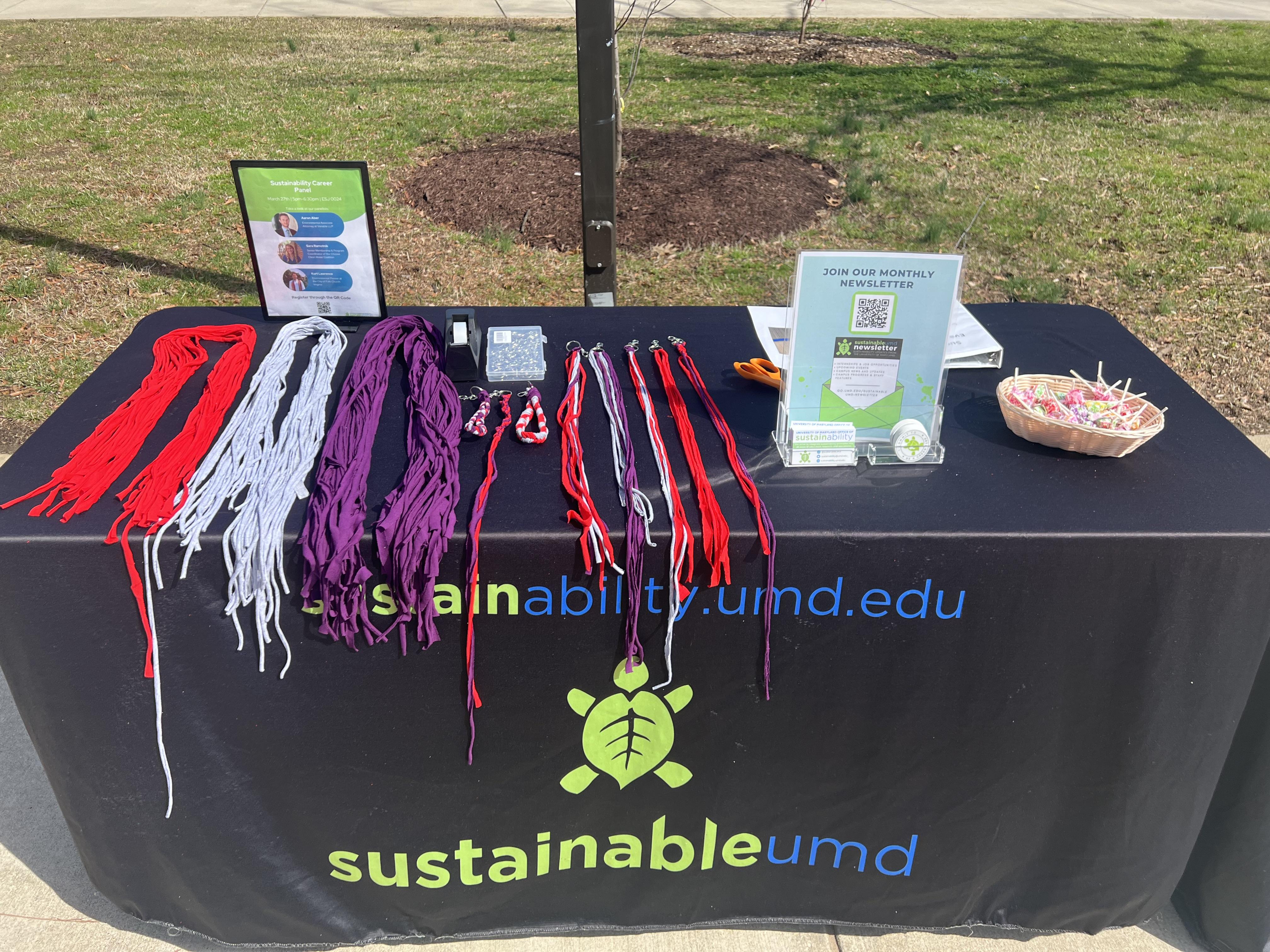 Table set up at the event including key rings and upcycled t-shirts