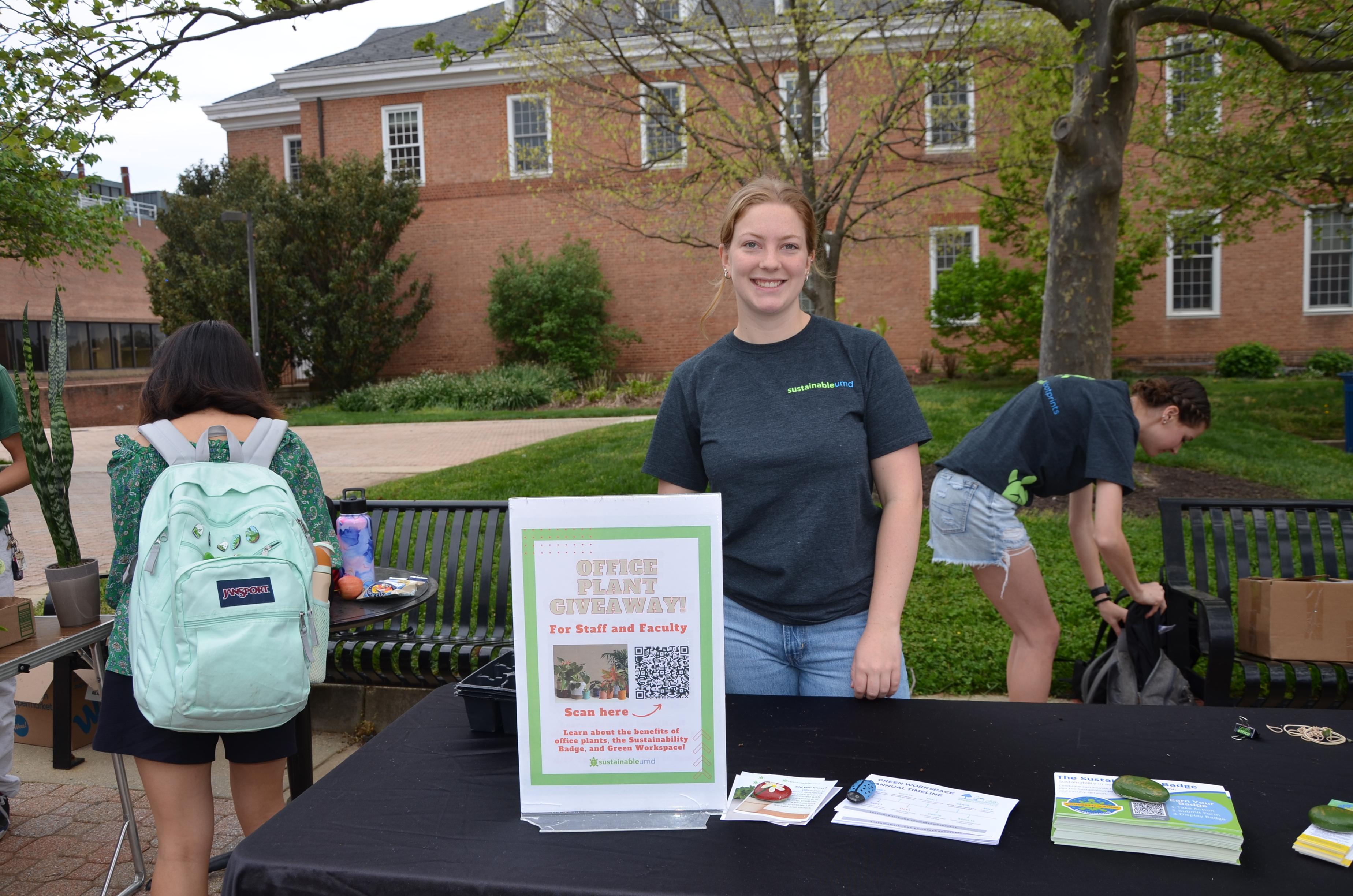 Staff engagement intern posing at the table