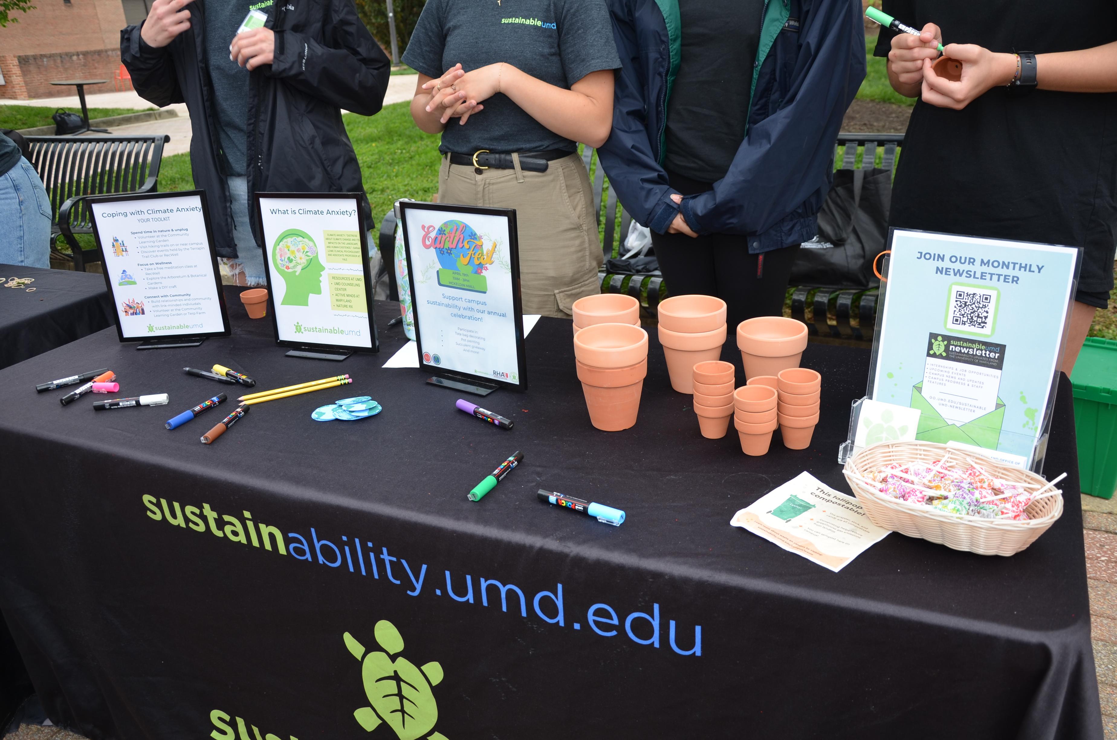 Terracotta pots and signage at the event