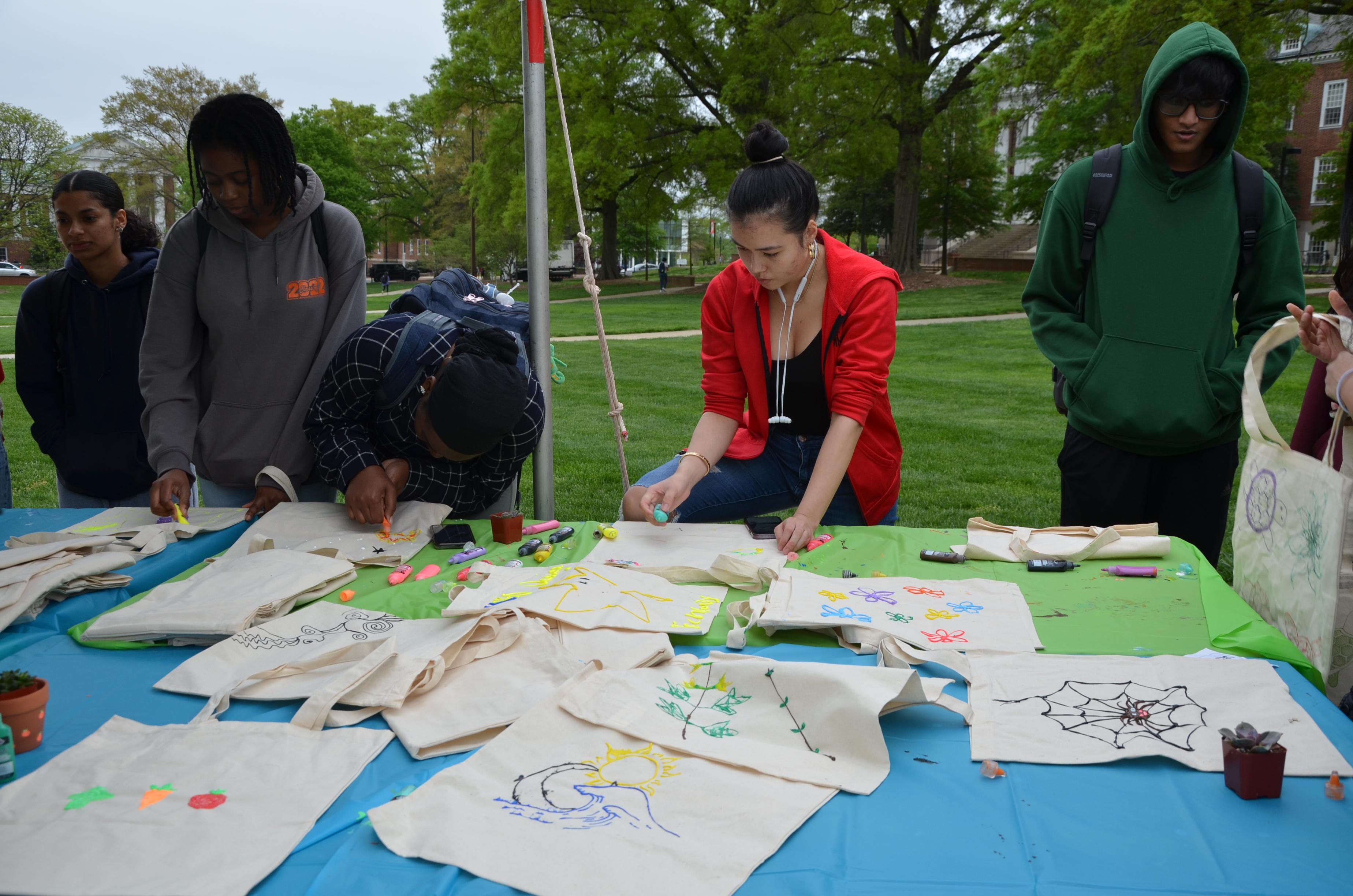 Students designing reusable tote bags