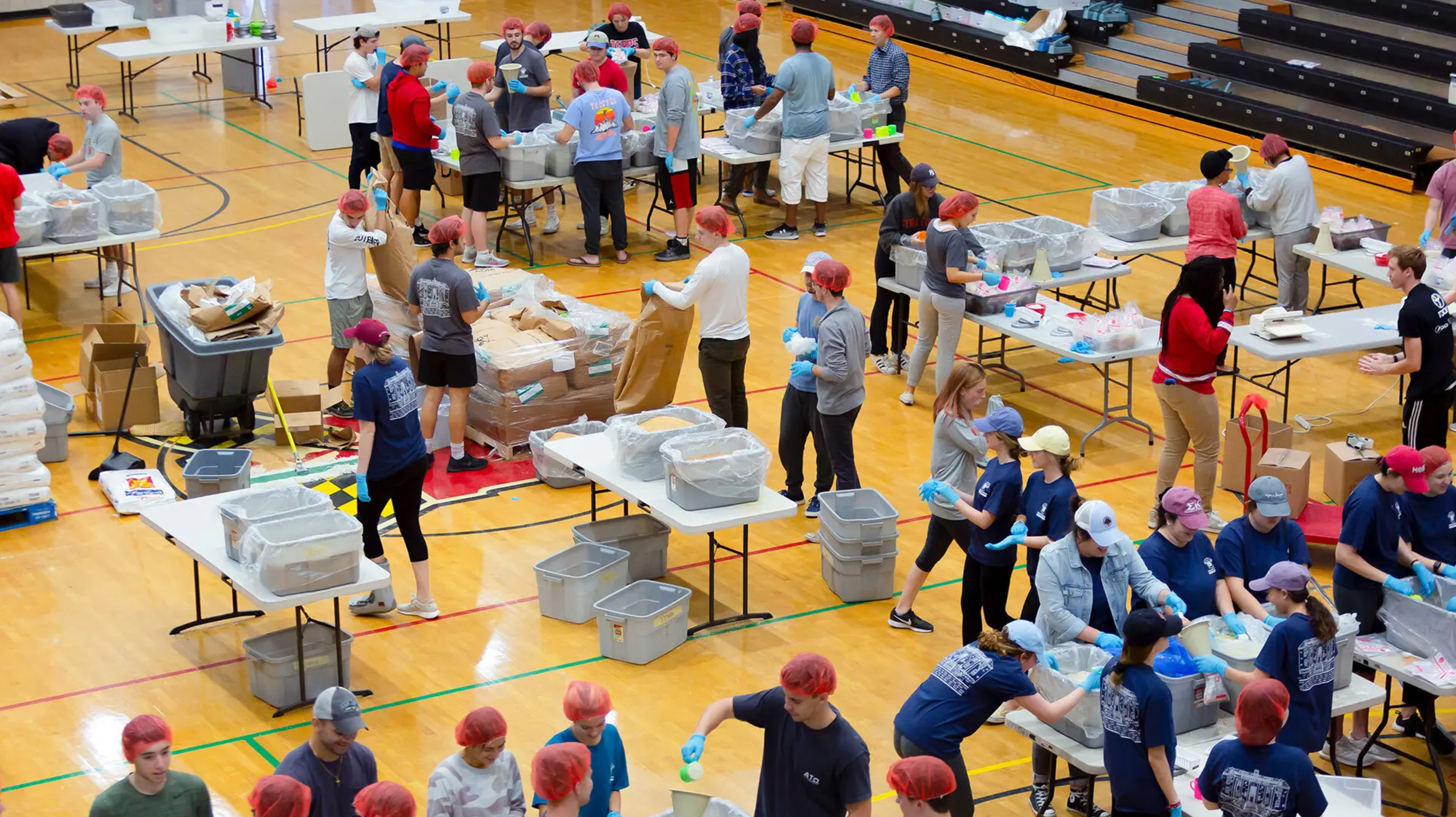 students package food at Terps Against Hunger event