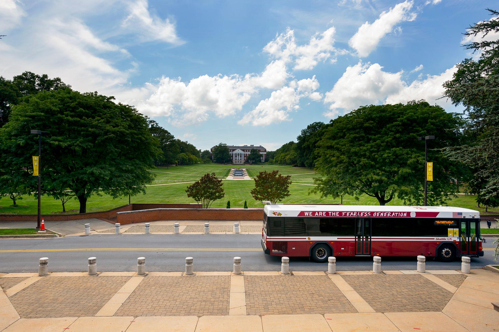 Bus driving past McKeldin Mall