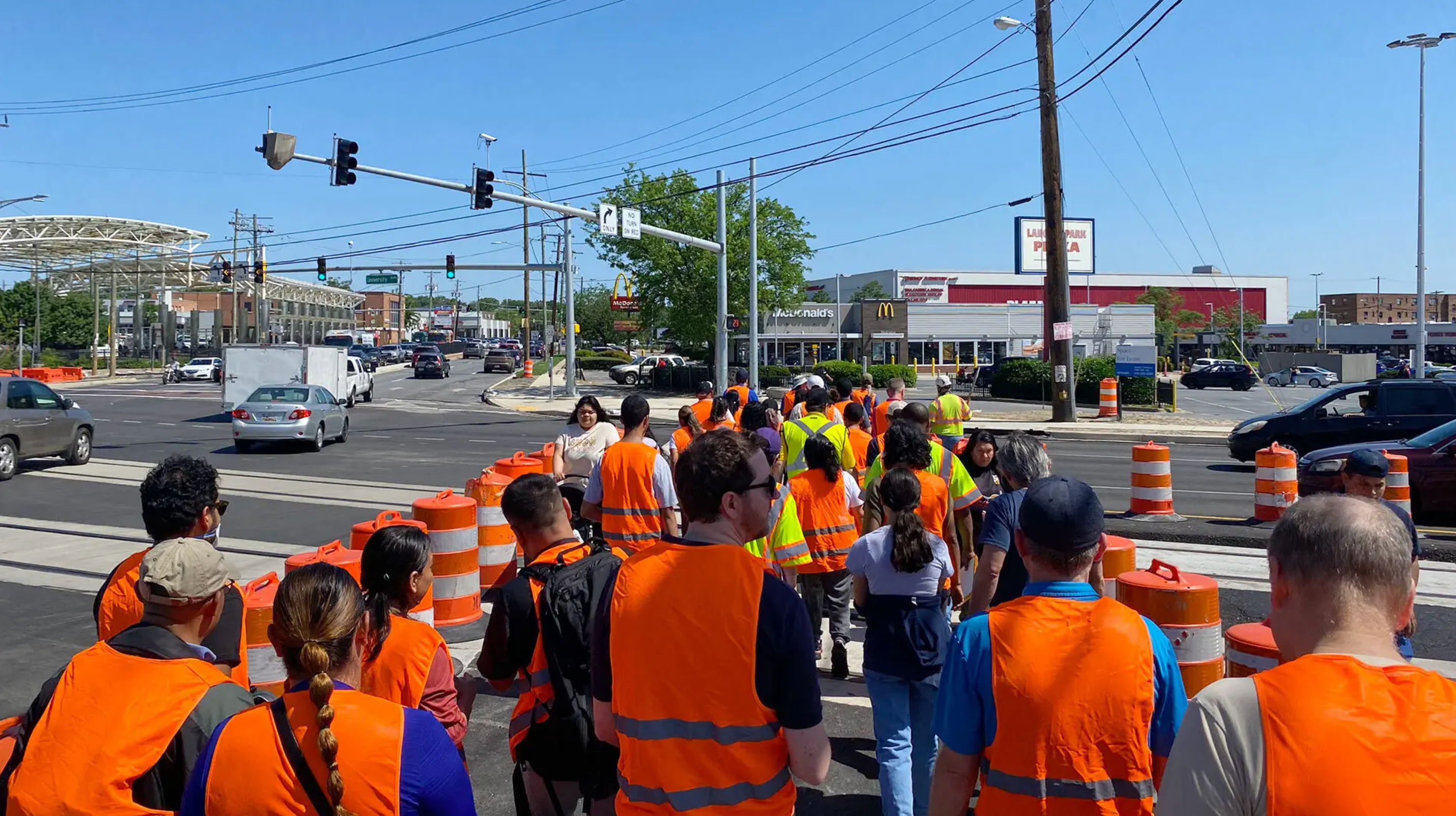 State, city and county officials involved with the $9.5 billion Purple Line project walk a two-mile loop around the planned stop in Langley Park, Md., to understand issues residents and business owners are facing amidst construction, and what infrastructure is needed to make the light rail an asset for the community.