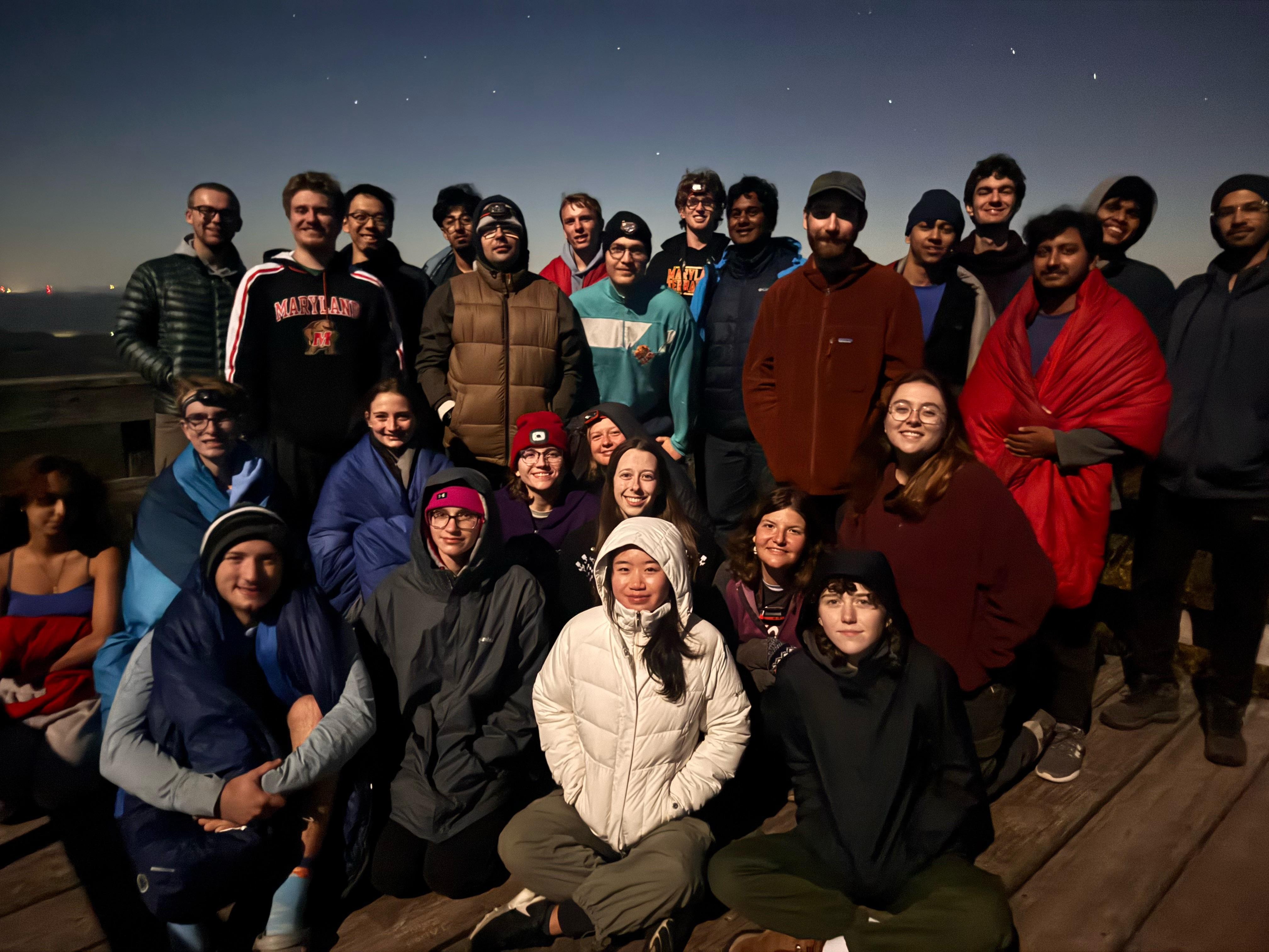 Students are photographed together outdoors after a hike.