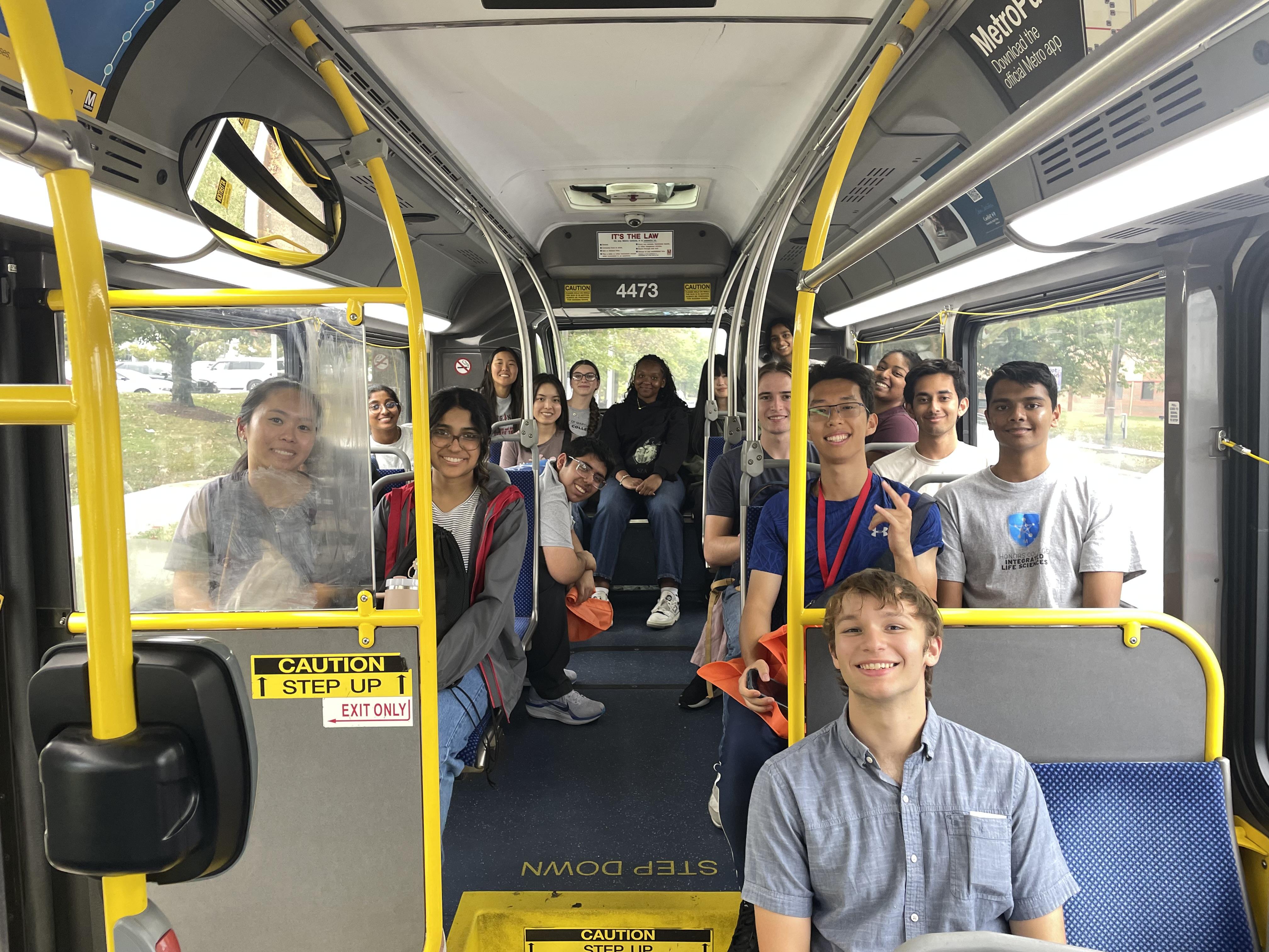 Students are photographed together riding a bus.
