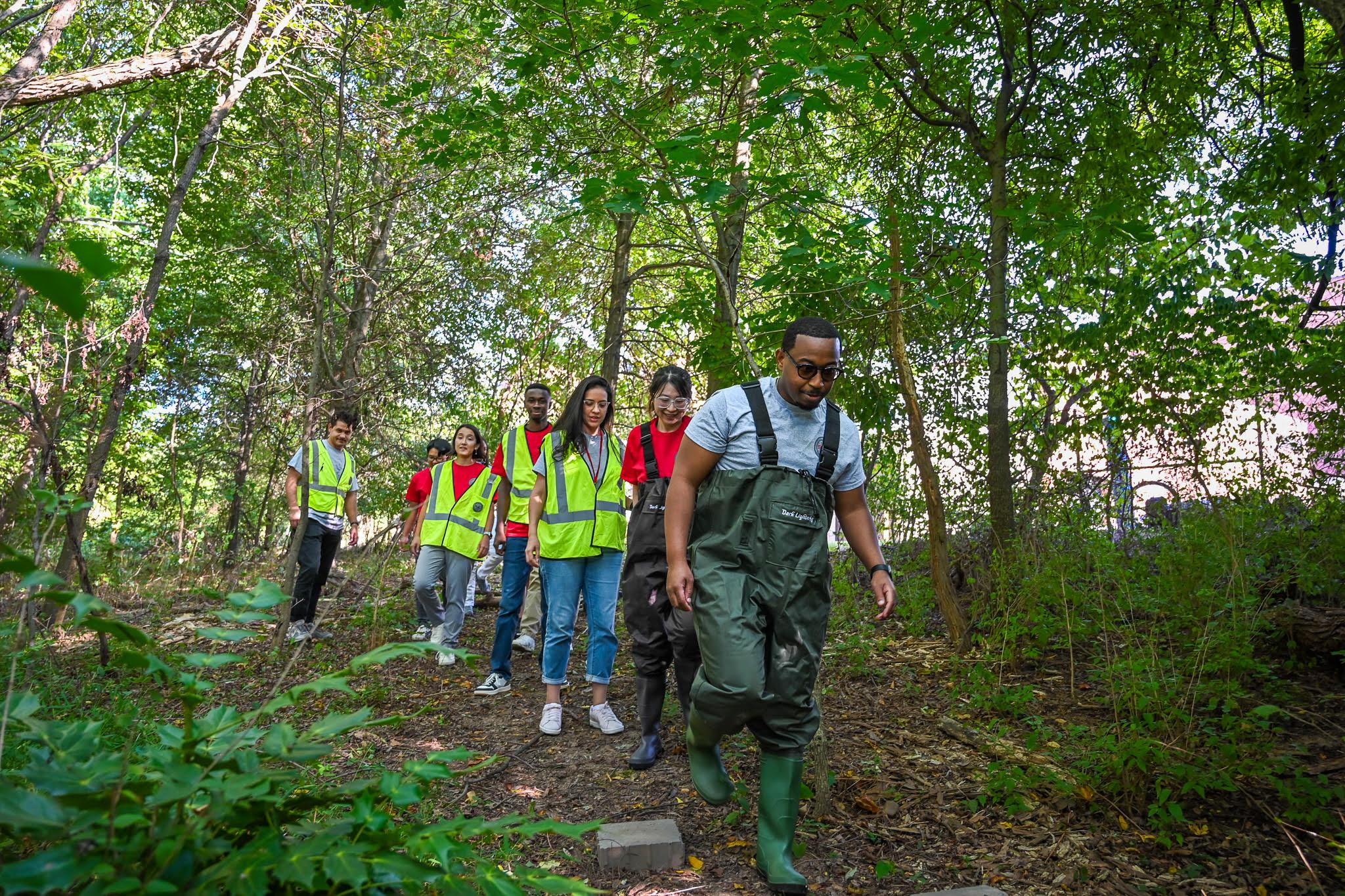 SIRJ team explores a stormwater basin on campus.