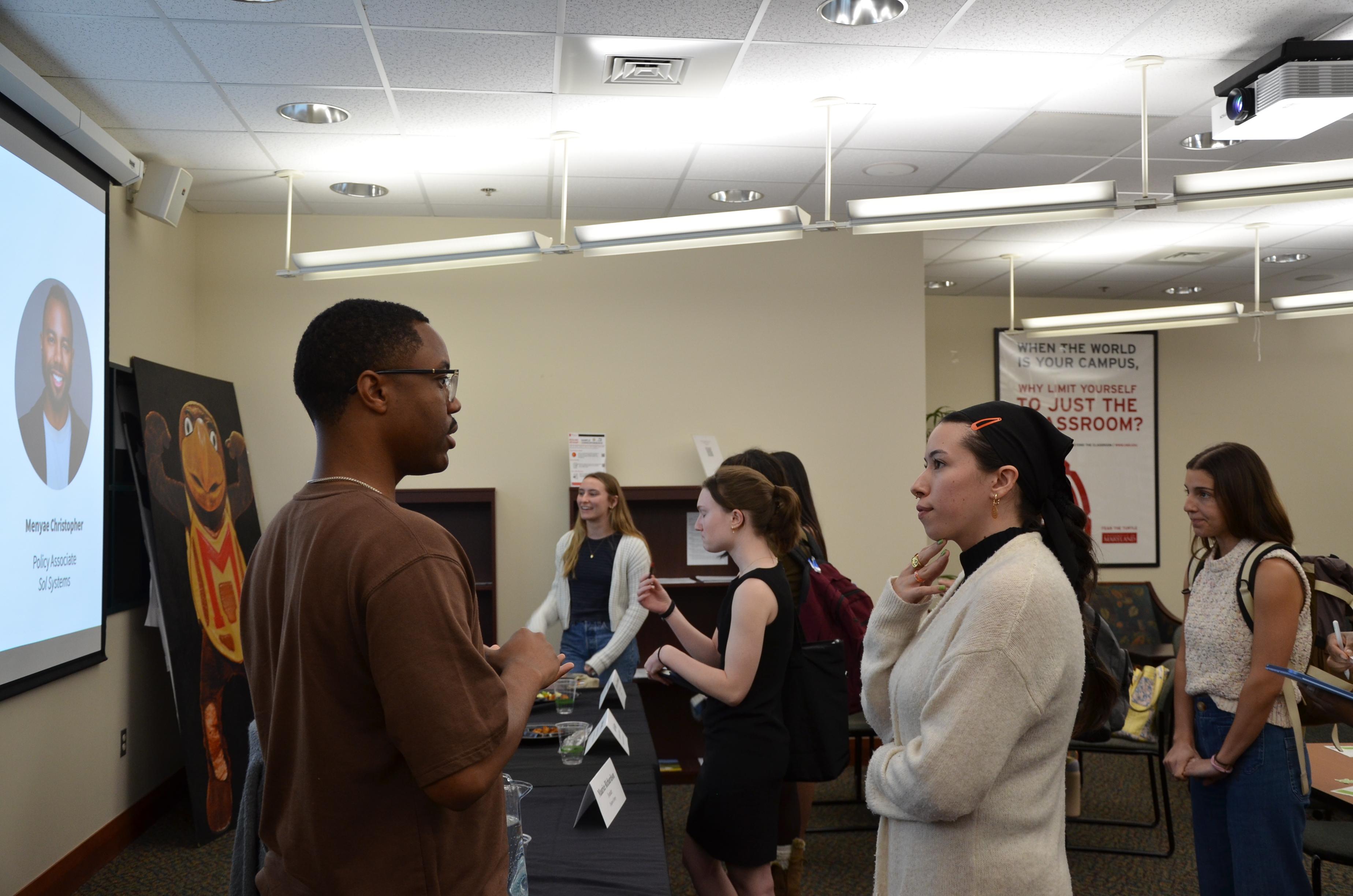 Student speaking to panelist