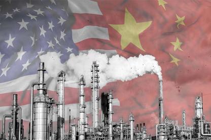 Industrial smokestacks emitting emissions with U.S. and China flags in the background, representing international climate cooperation.